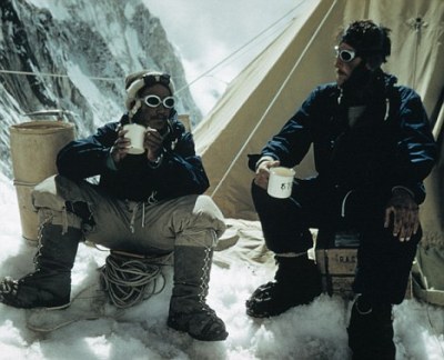 Tenzing Norgay and Edmund Hillary drink tea in the Western Cwm after their successful ascent of Mount Everest